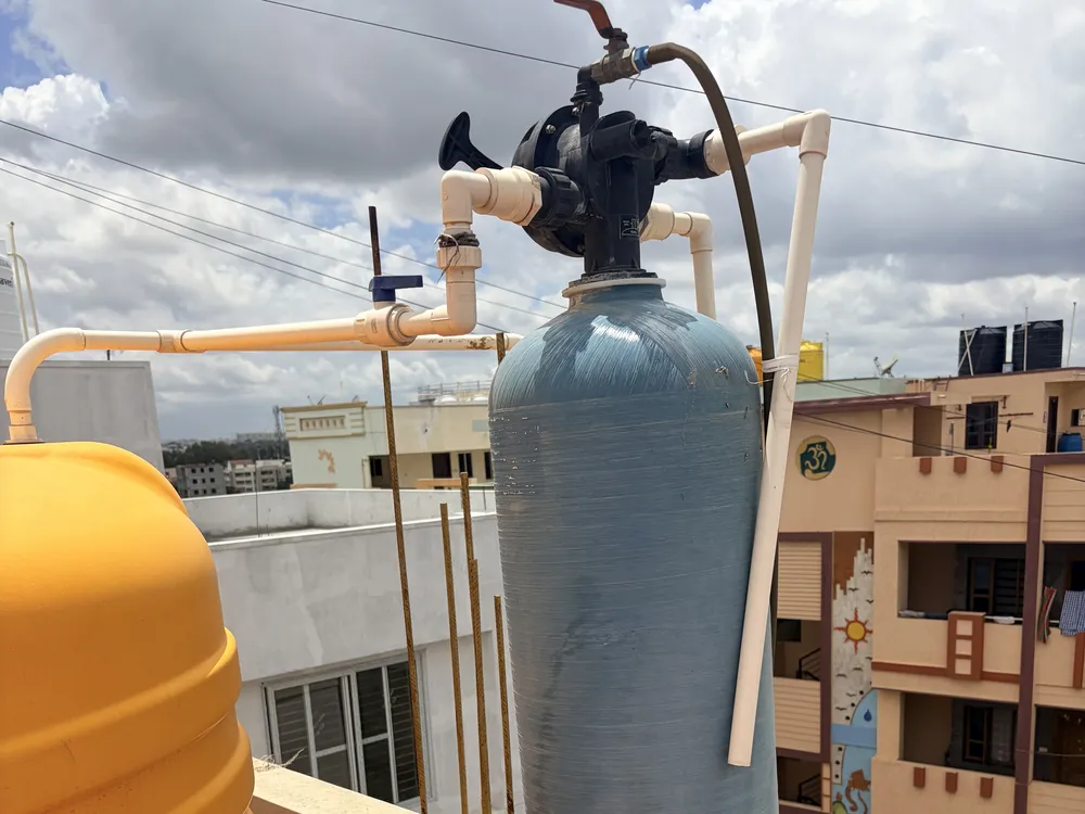 Water softener resin tank with control valve and plumbing connections
